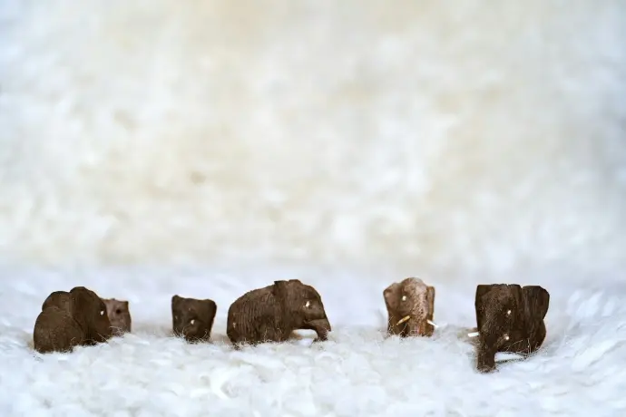 brown rock formation on snow covered ground